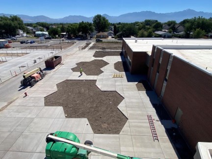 Preparation of planting areas on east and north of the building