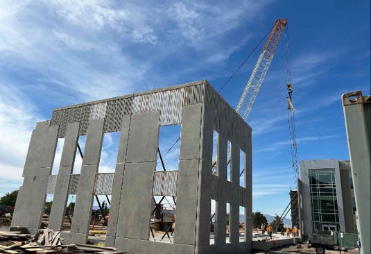 Performing Arts tilt wall being lifted into place
