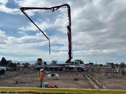 Pouring concrete footings East of the orchestra pit
